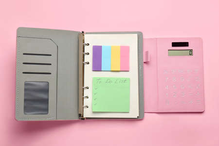 Notebook and blank to-do list on color backgroundの写真素材