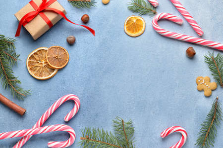Beautiful Christmas composition with candy canes on color background