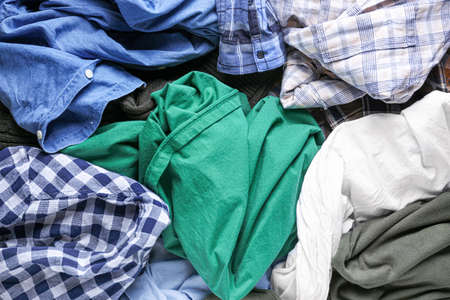 Heap of different clothes, top view