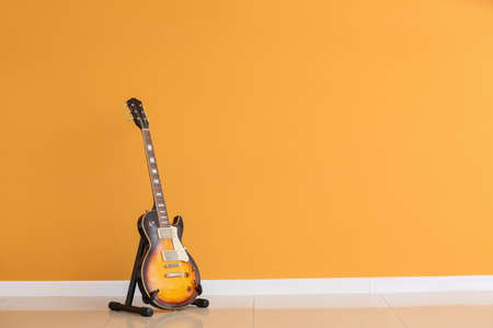 Modern guitar near color wallの写真素材