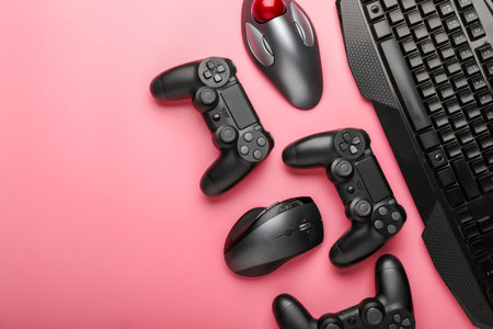 Modern gaming accessories on color background
