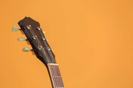 Modern guitar on color backgroundの写真素材