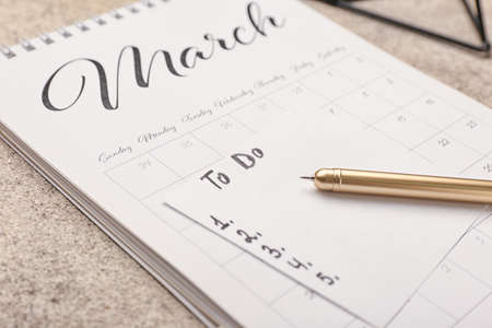 Empty to do list with calendar on table, closeupの写真素材