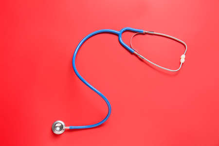 Modern stethoscope on color backgroundの写真素材