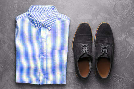 Stylish male shoes and shirt on gray backgroundの写真素材