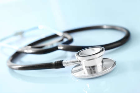 Modern stethoscope on white table, closeupの写真素材