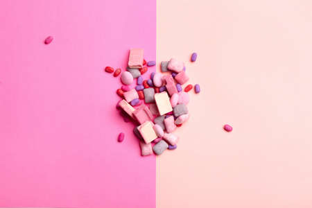 Different chewing gums on color background