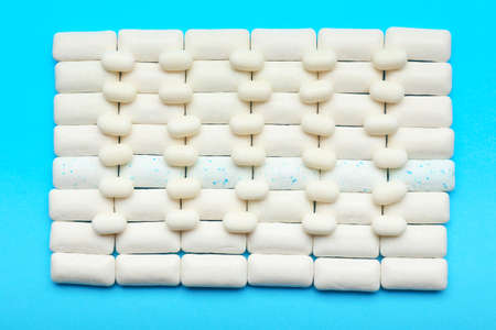 Different chewing gums on color backgroundの写真素材