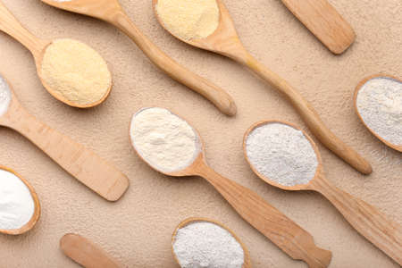 Spoons with different flour on color backgroundの写真素材