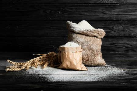 Bags with flour on dark backgroundの写真素材