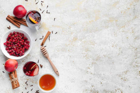 Composition with tasty mulled wine on light background