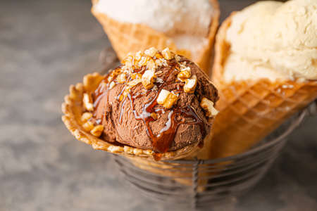 Sweet tasty ice-cream on table