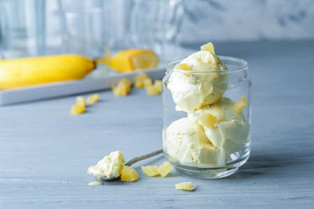 Tasty ice-cream in glass on table