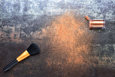 Makeup brush and glitters on grunge backgroundの写真素材