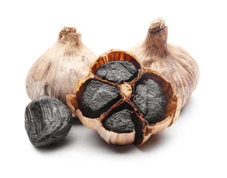 Black garlic on white backgroundの写真素材
