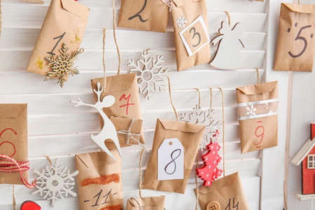 Christmas advent calendar with envelopes on folding screenの写真素材