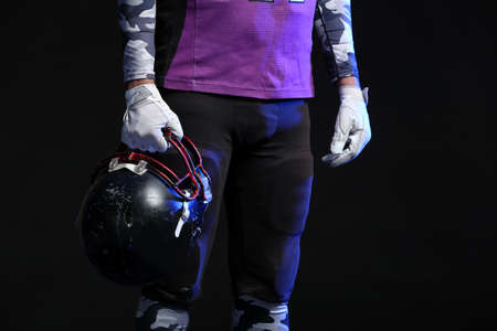 American football player on dark backgroundの写真素材