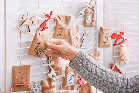 Woman making Christmas advent calendarの写真素材