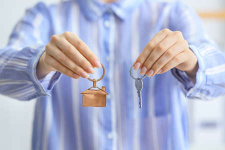 Real estate agent with key, closeup