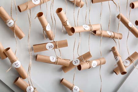 Creative Christmas advent calendar on light wallの写真素材
