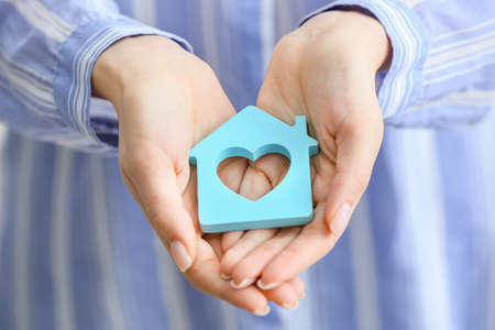 Real estate agent with shape of house, closeupの写真素材