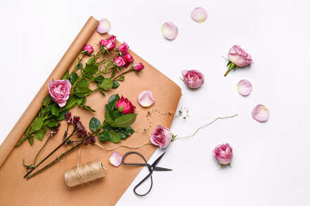 Supplies of florist with fresh flowers on white backgroundの写真素材