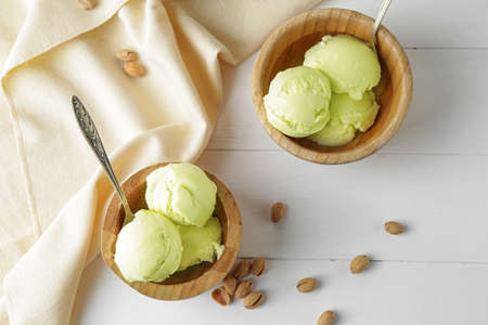 Bowls with tasty ice-cream on tableの写真素材