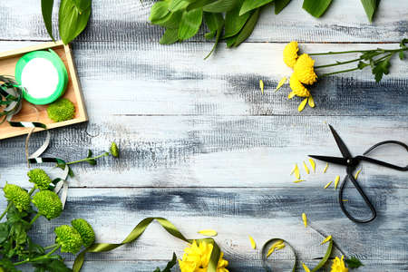 Workplace of professional florist on wooden background