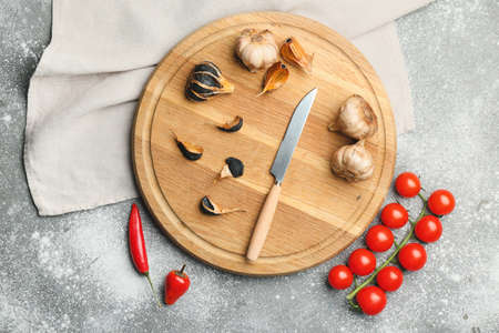 Composition with black garlic on tableの写真素材