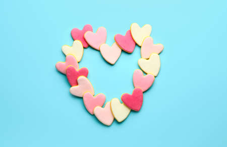 Heart shaped cookies for Valentine's day on color background