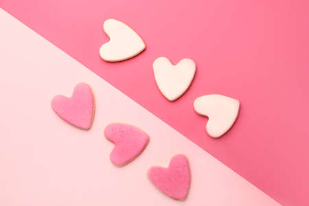 Heart shaped cookies for Valentine's day on color backgroundの写真素材