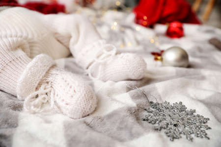 Legs of little baby lying on plaid, closeupの写真素材