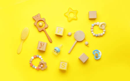 Baby toys on color background