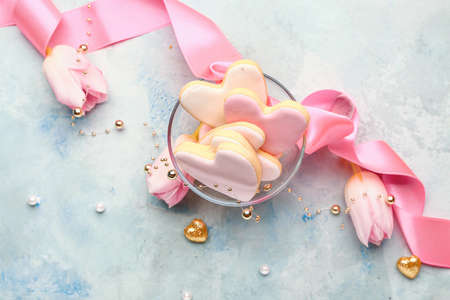 Bowl with tasty heart-shaped cookies on color background. Valentines Day celebration
