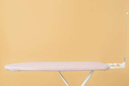 Ironing board against color backgroundの写真素材