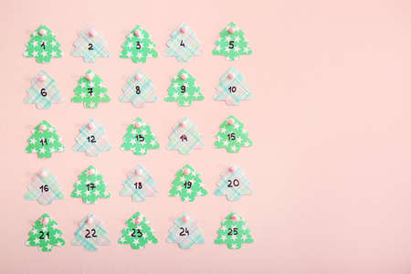 Creative Christmas calendar on color wallの写真素材