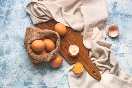 Sack with fresh eggs on color backgroundの写真素材