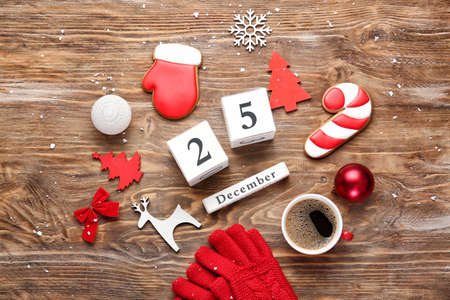 Christmas decor, coffee and calendar on wooden backgroundの写真素材