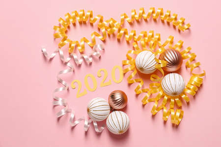 Figure 2020 with decor on color background. New year celebration