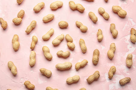 Tasty peanuts on color backgroundの写真素材
