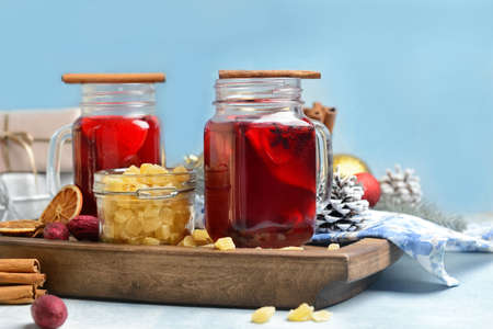 Mason jars of tasty mulled wine on tableの写真素材
