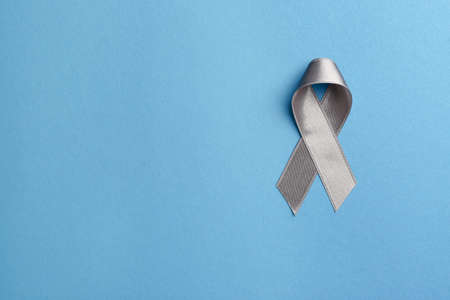 Silver ribbon on blue backgroundの写真素材