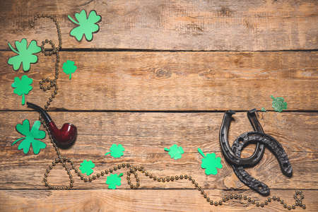 Composition for St. Patrick's Day on wooden background