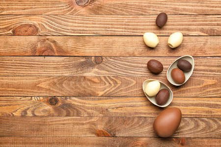 Chocolate Easter eggs on wooden backgroundの写真素材