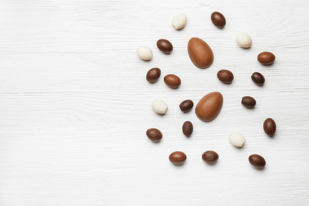 Chocolate Easter eggs on wooden backgroundの写真素材