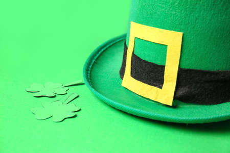 Leprechaun's hat and shamrock on green background. St. Patrick's day celebrationの写真素材