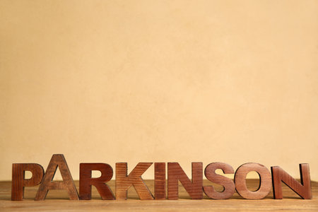 Word PARKINSON on table on color backgroundの写真素材