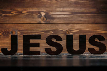 Word JESUS on wooden tableの写真素材
