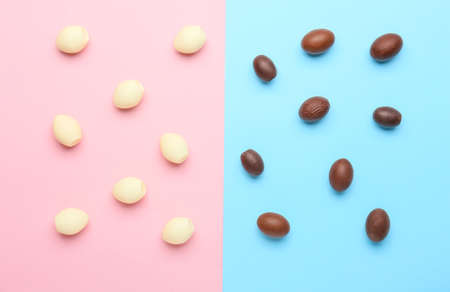 Chocolate Easter eggs on color background