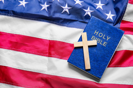 Christian cross and Bible on USA flagの写真素材